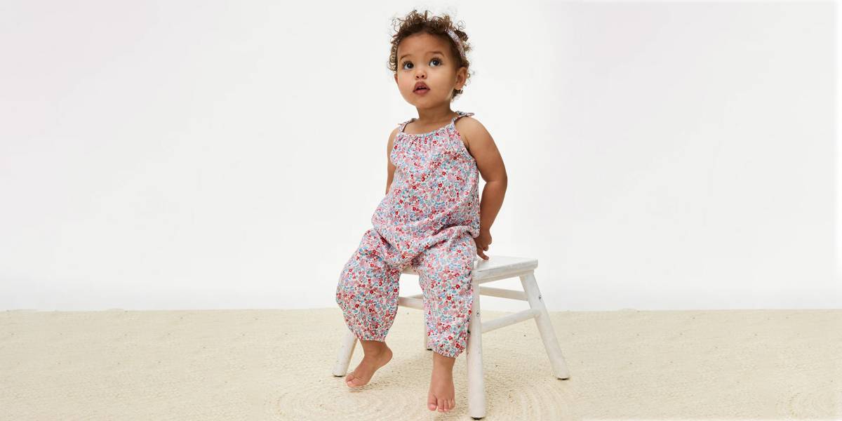 Baby girl wearing floral jumpsuit 